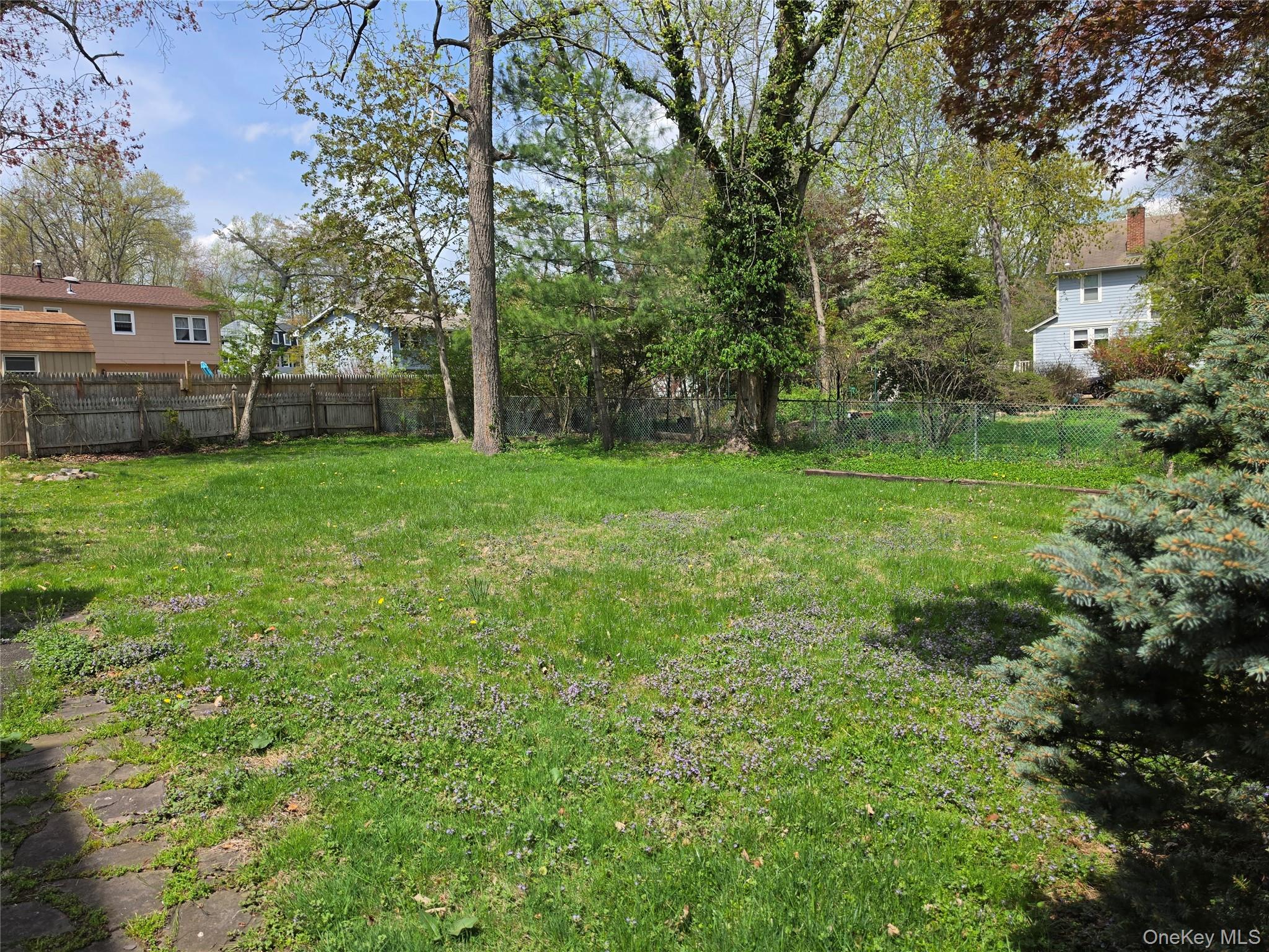 60 Main Street Tappan, NY 10983 - Photo 18 of 22 a view of a backyard with garden