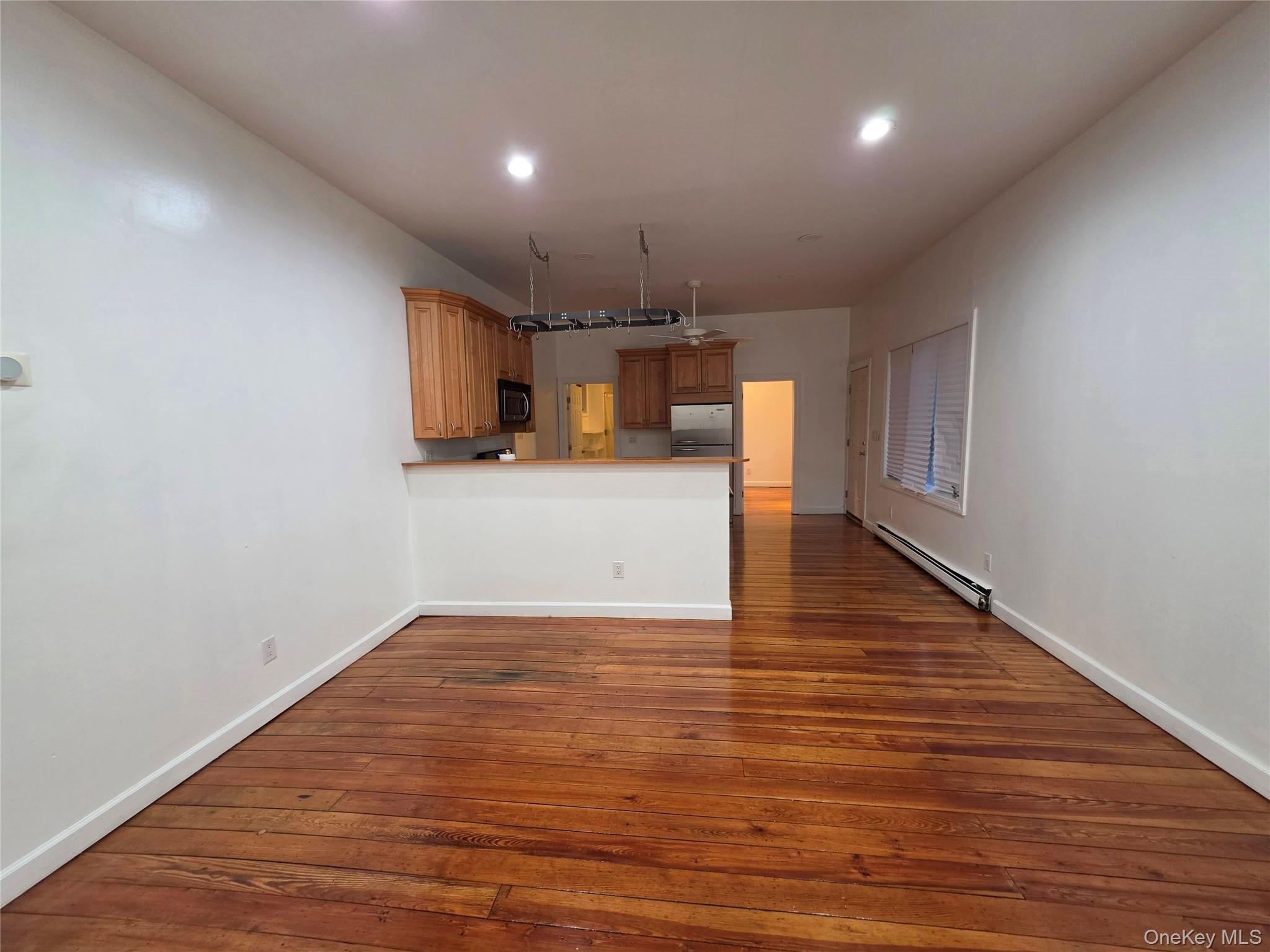 60 Main Street Tappan, NY 10983 - Photo 4 of 22 a view of a kitchen with a sink and a refrigerator