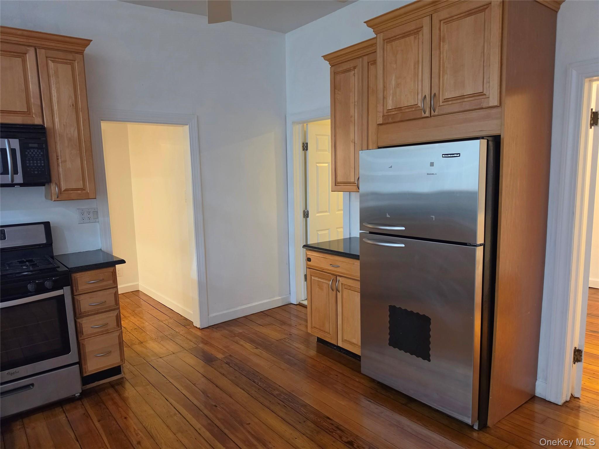 60 Main Street Tappan, NY 10983 - Photo 6 of 22 a kitchen with wooden floors and a stove