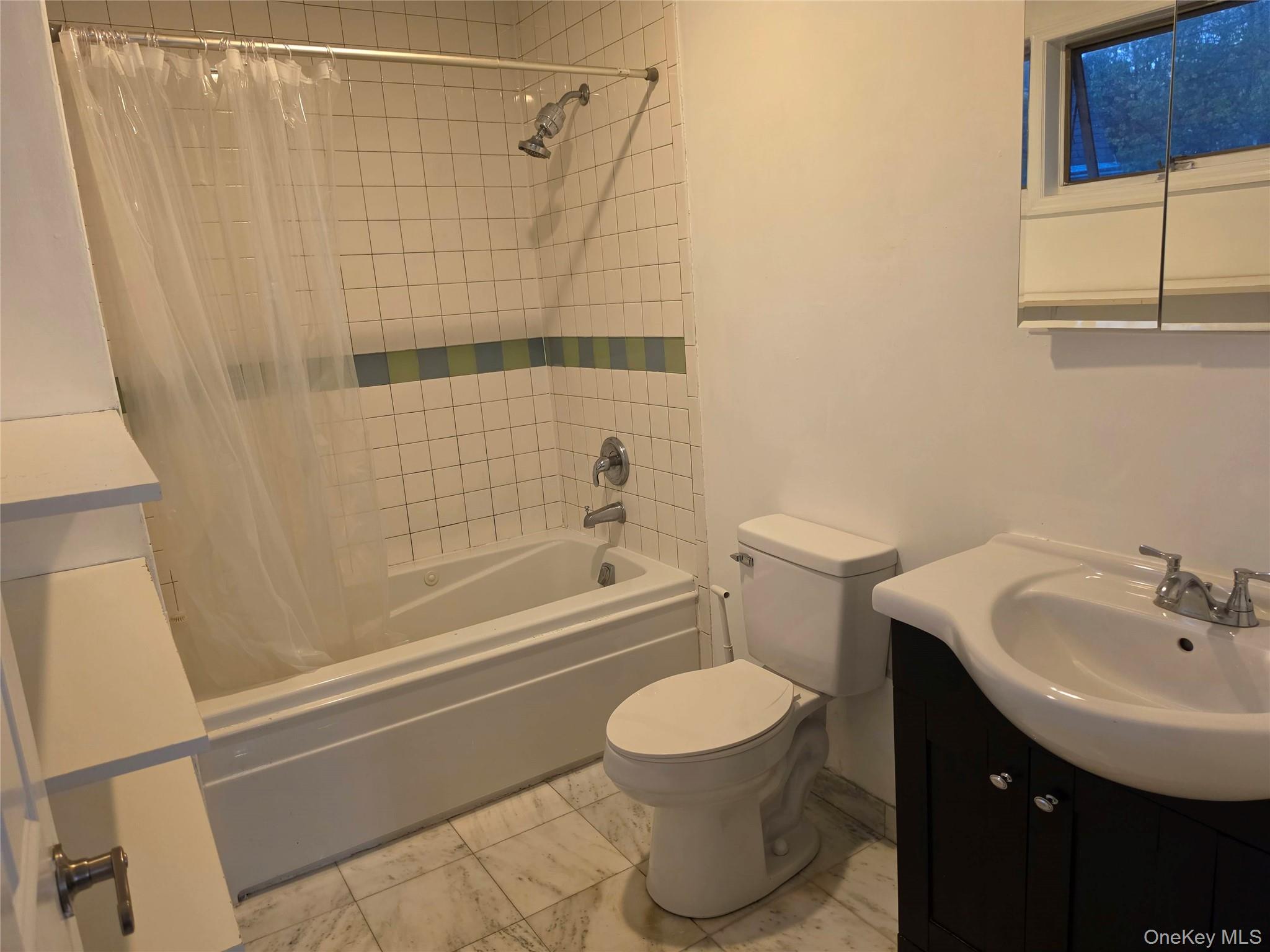 60 Main Street Tappan, NY 10983 - Photo 8 of 22 a bathroom with a sink toilet and shower
