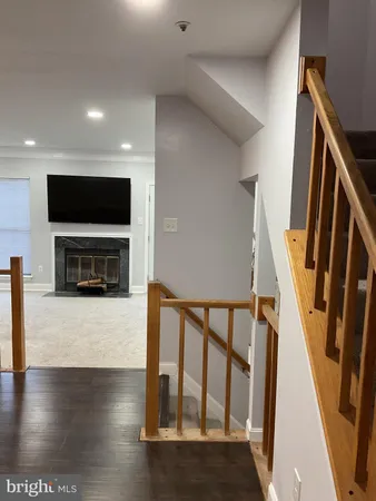 an empty room with wooden floor
