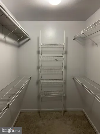 an empty room with a bathroom and a toilet