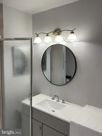 a white toilet sitting next to a bathroom sink