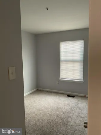 a view of a bathroom from the hallway