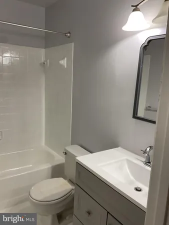 a view of a livingroom with an empty space and a window