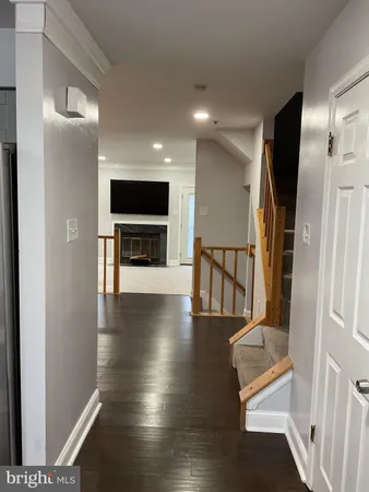 a kitchen with granite countertop a stove a sink and a microwave