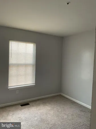 a view of a room with wooden walls