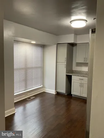 a kitchen with stainless steel appliances granite countertop a sink and a stove