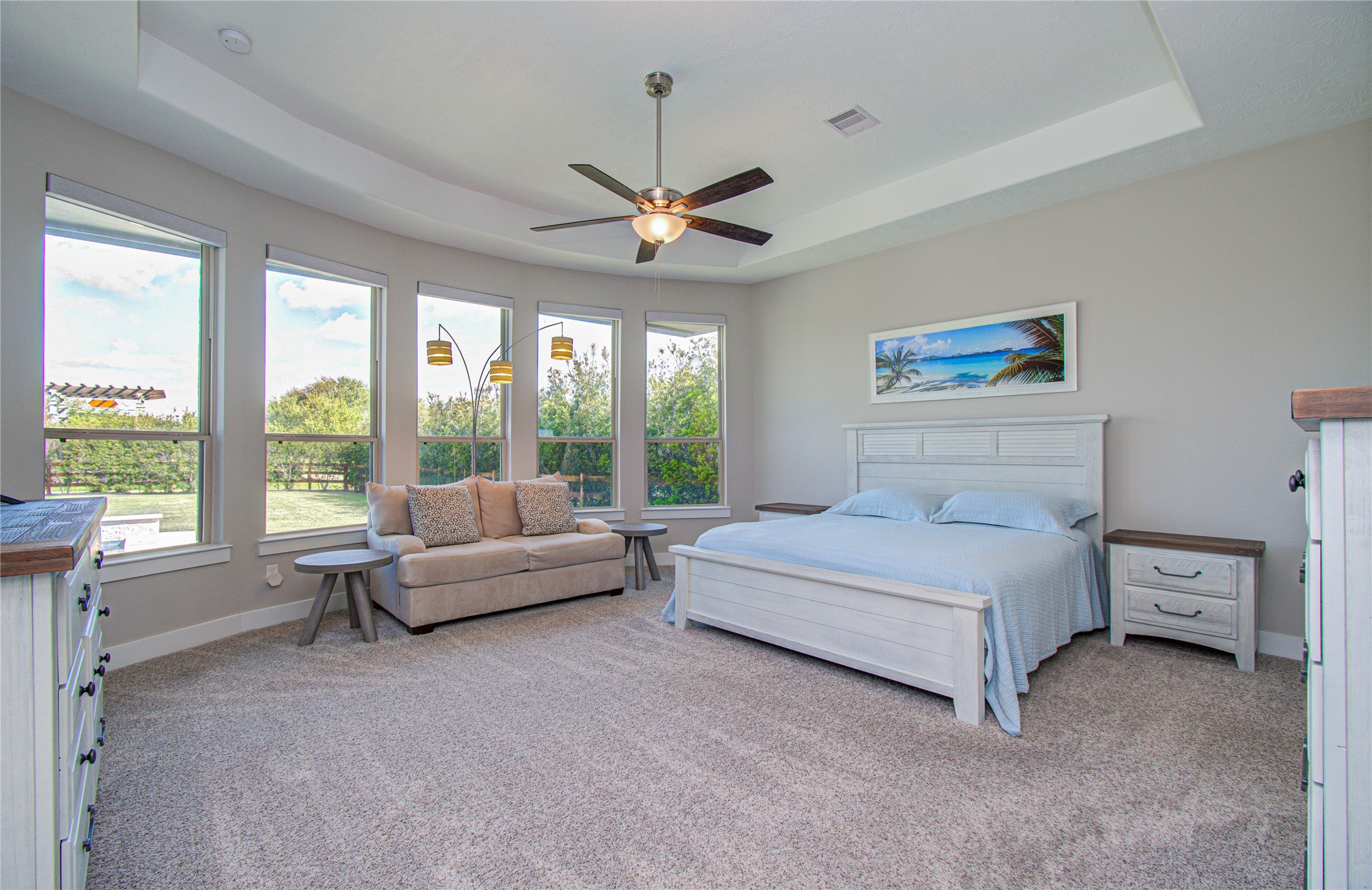 29702 Hay Field Lane Fulshear, TX 77406 - Photo 21 of 45 a spacious bedroom with a large bed and a large window