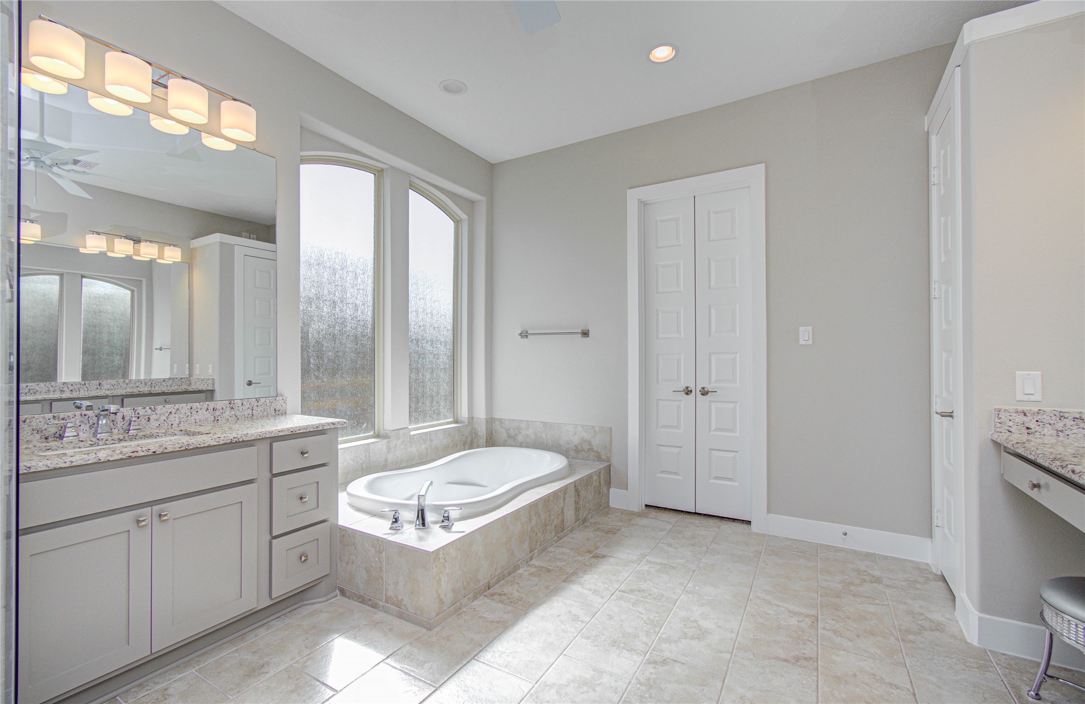 29702 Hay Field Lane Fulshear, TX 77406 - Photo 24 of 45 a spacious bathroom with a granite countertop tub sink shower and mirror