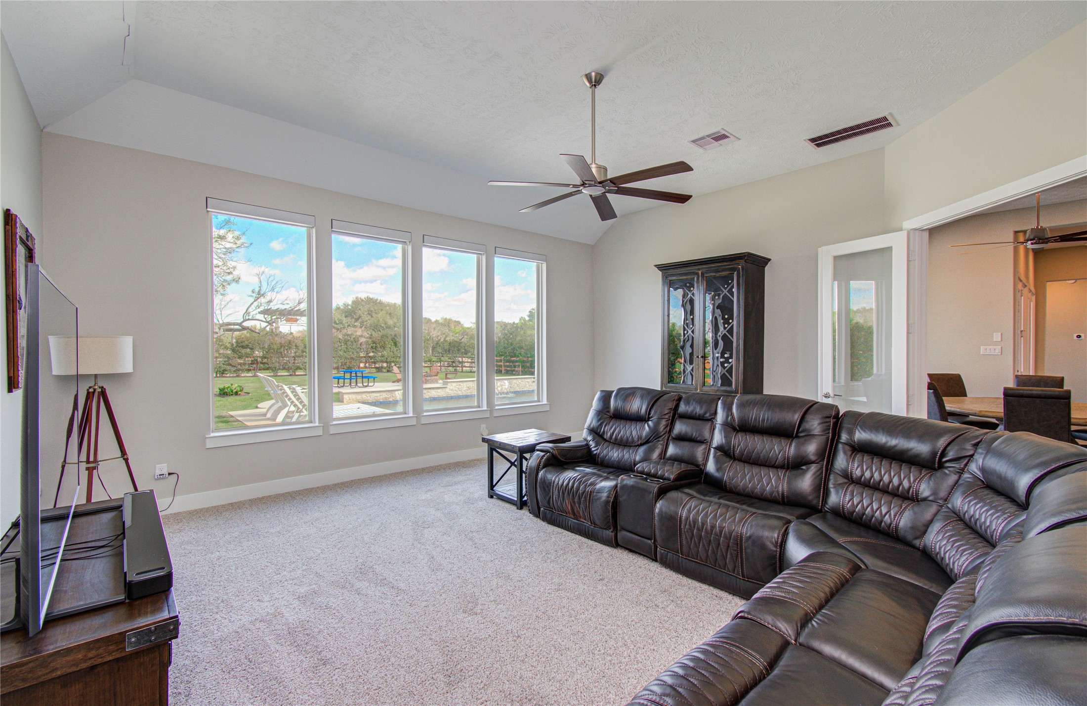 29702 Hay Field Lane Fulshear, TX 77406 - Photo 27 of 45 a living room with furniture ceiling fan and a window
