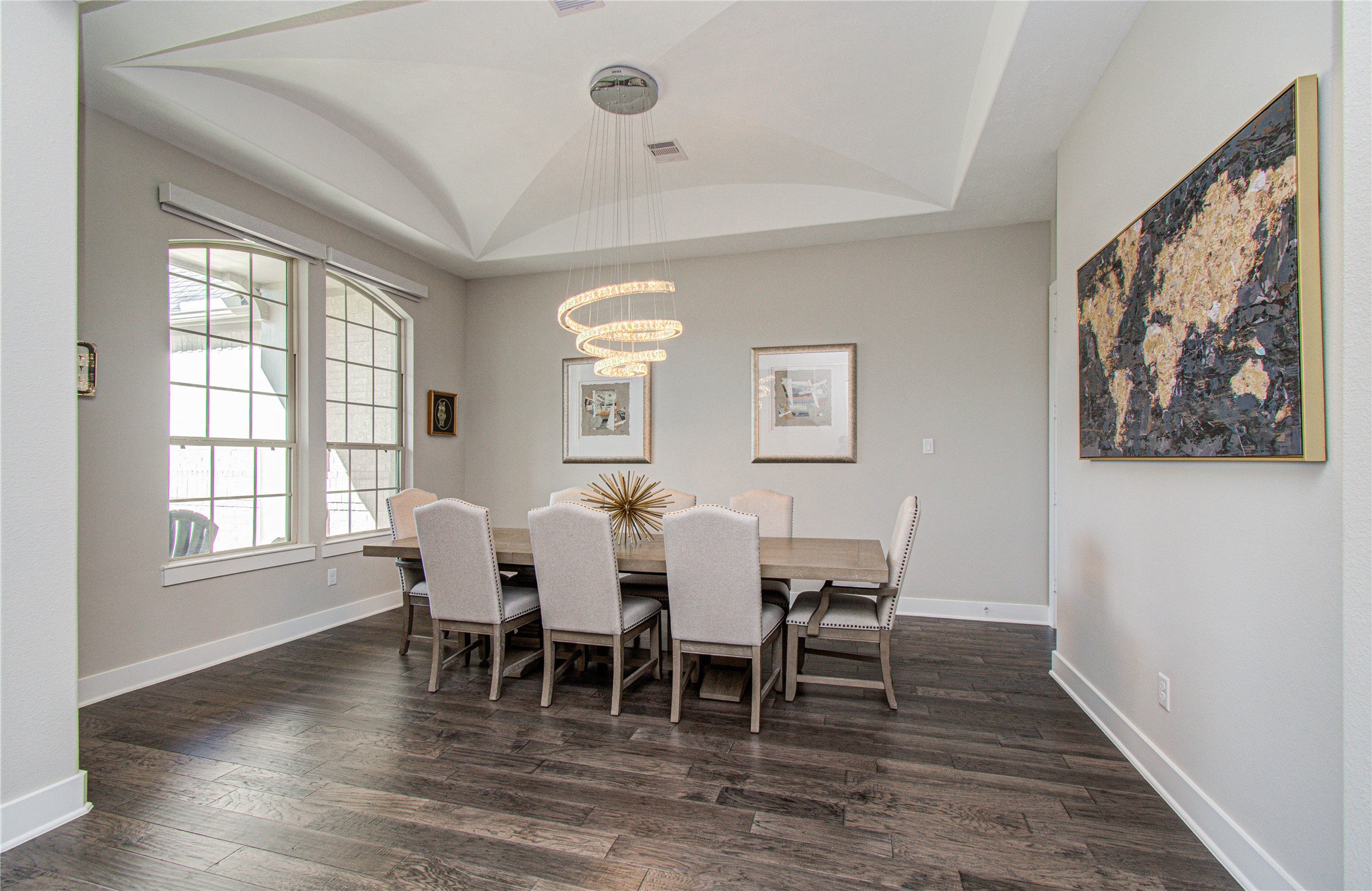 29702 Hay Field Lane Fulshear, TX 77406 - Photo 30 of 45 a dining room with wooden floor and windows