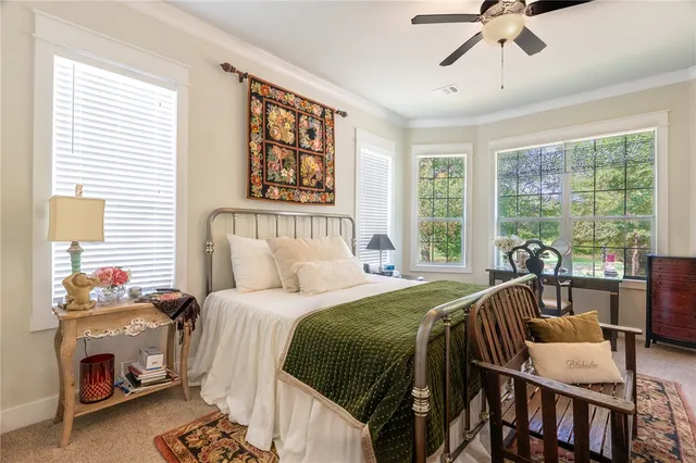 a bedroom with a bed and a table