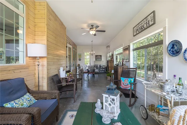 a living room with furniture a fireplace and a table