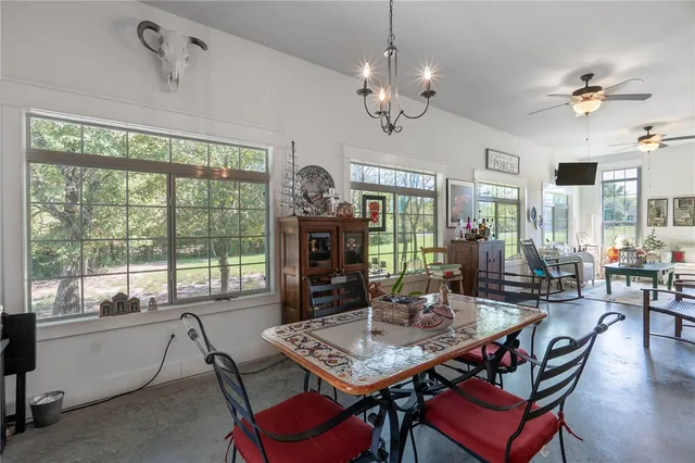 a view of a dining room with furniture window and outside view