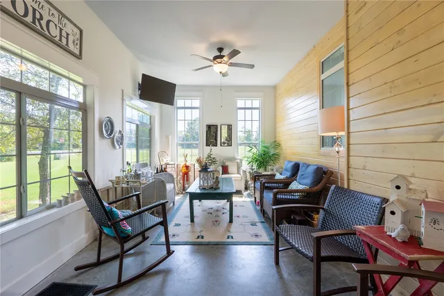 a living room with furniture and a window