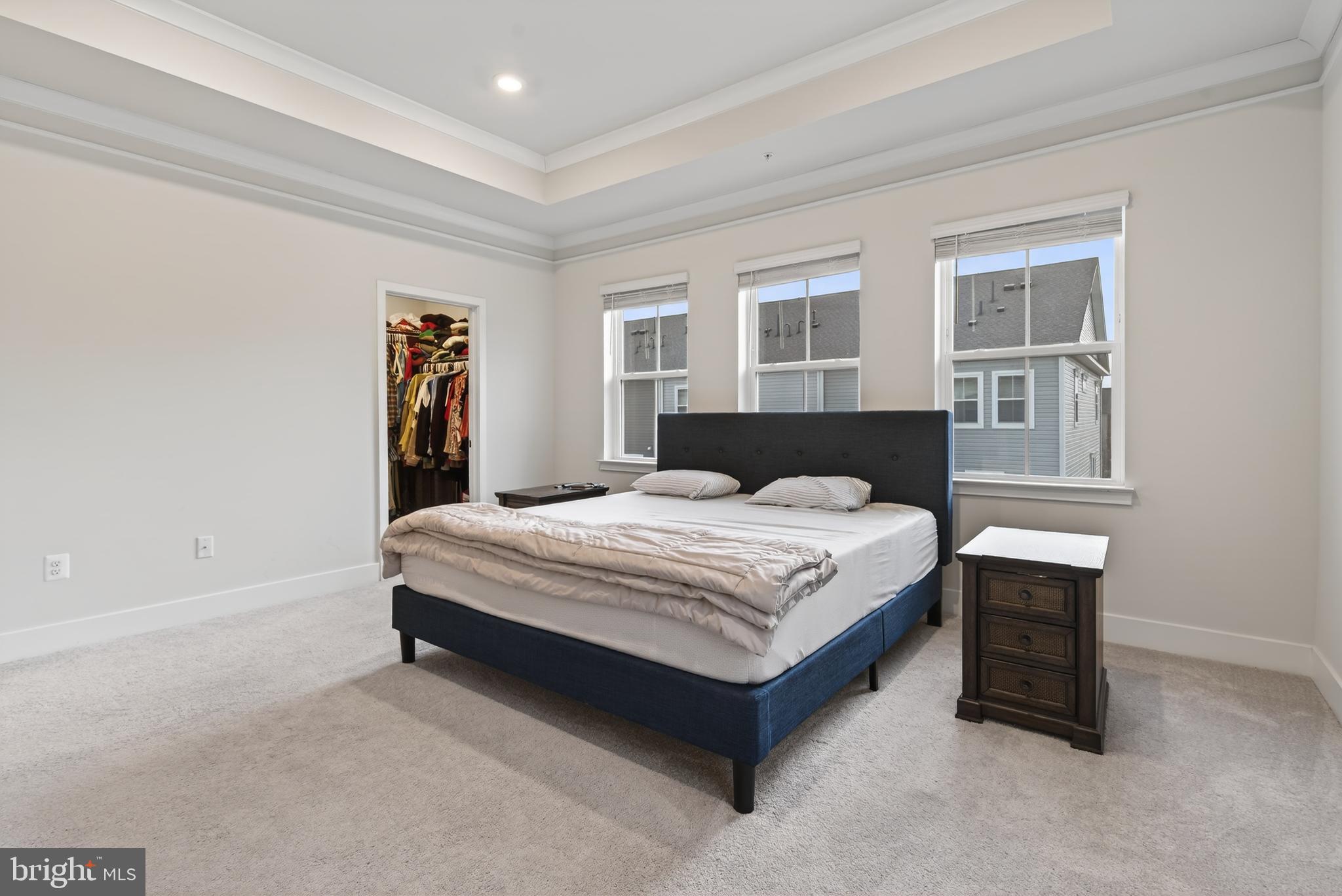 7201 Gringotts Way, Unit B Elkridge, MD 21075 - Photo 19 of 37 a spacious bedroom with a bed and a window