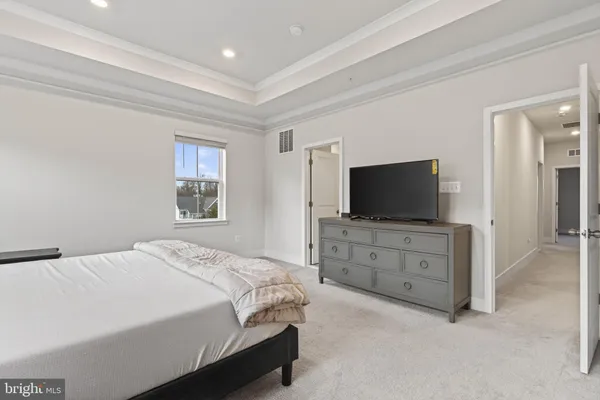 a bedroom with a bed and a television in it