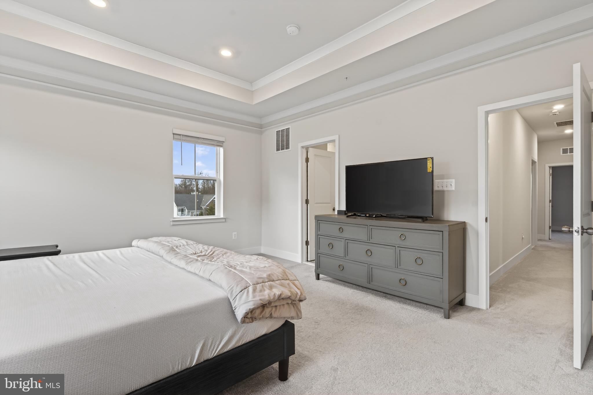 7201 Gringotts Way, Unit B Elkridge, MD 21075 - Photo 22 of 37 a bedroom with a bed and a television in it