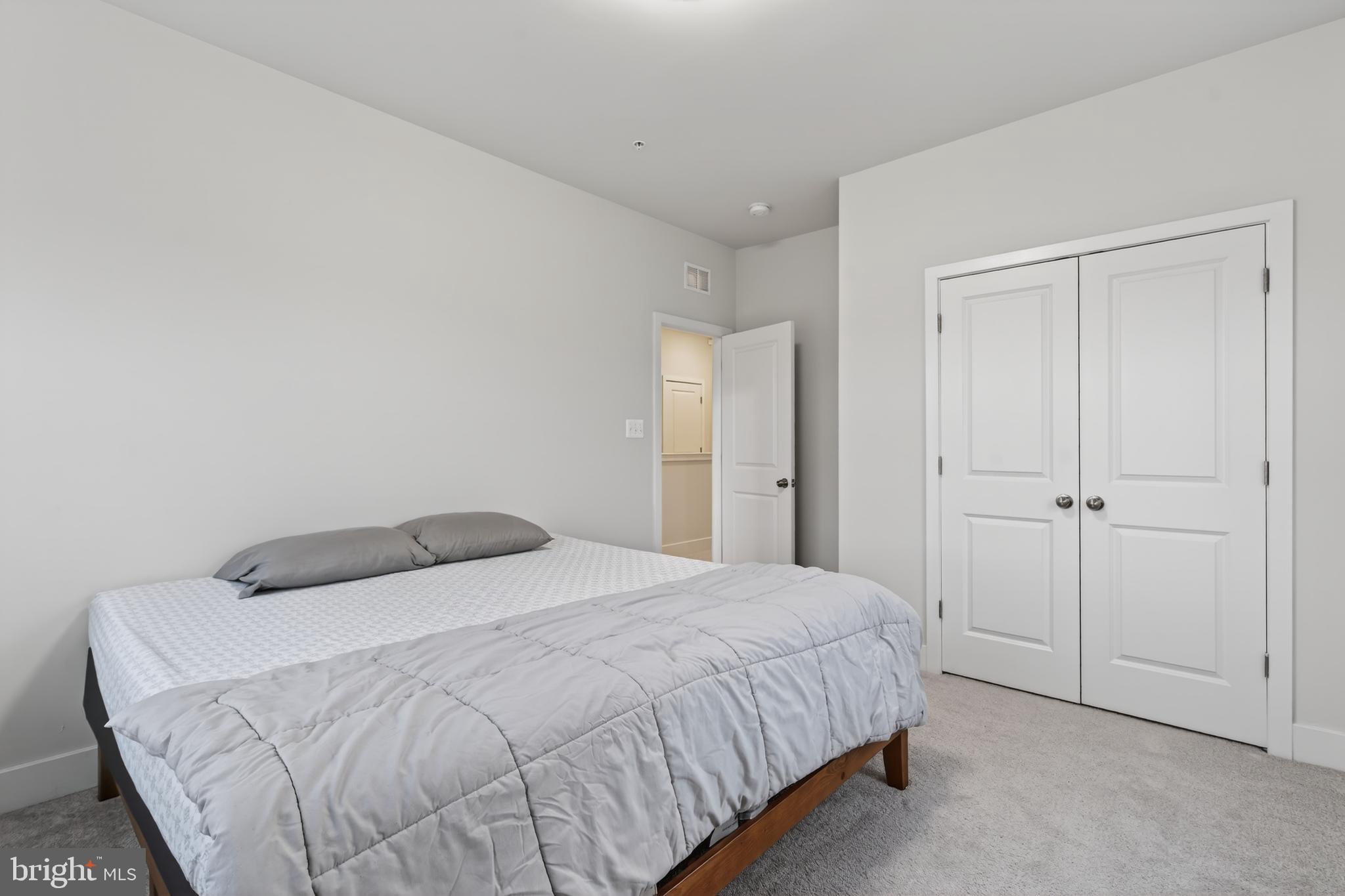 7201 Gringotts Way, Unit B Elkridge, MD 21075 - Photo 29 of 37 a bedroom with a bed and a closet