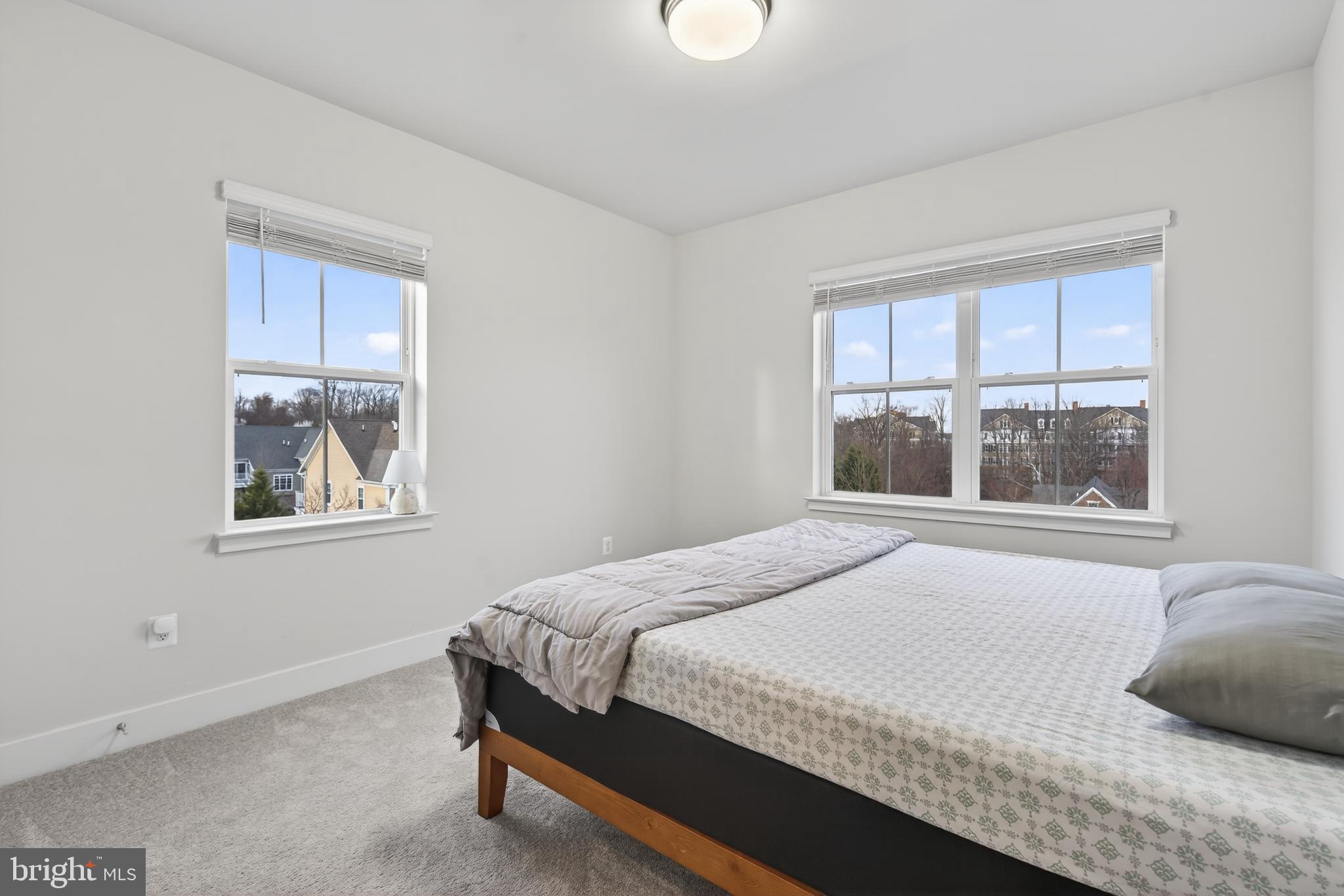 7201 Gringotts Way, Unit B Elkridge, MD 21075 - Photo 30 of 37 a bedroom with a bed and a window