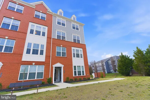a view of a building with a yard