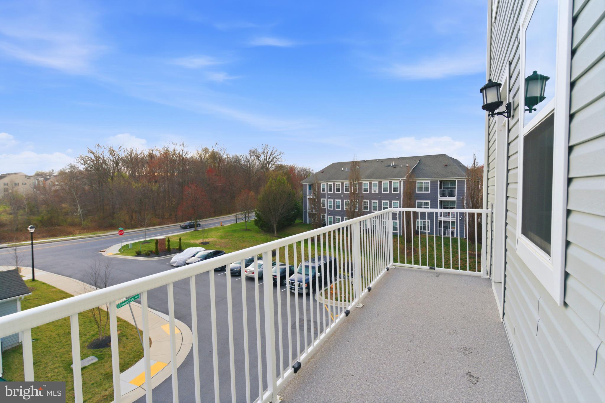 7201 Gringotts Way, Unit B Elkridge, MD 21075 - Photo 32 of 37 a view of a balcony with an outdoor space