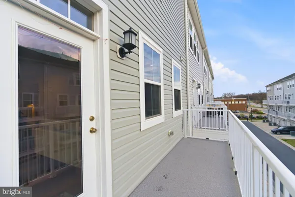 a view of a balcony with wooden floor