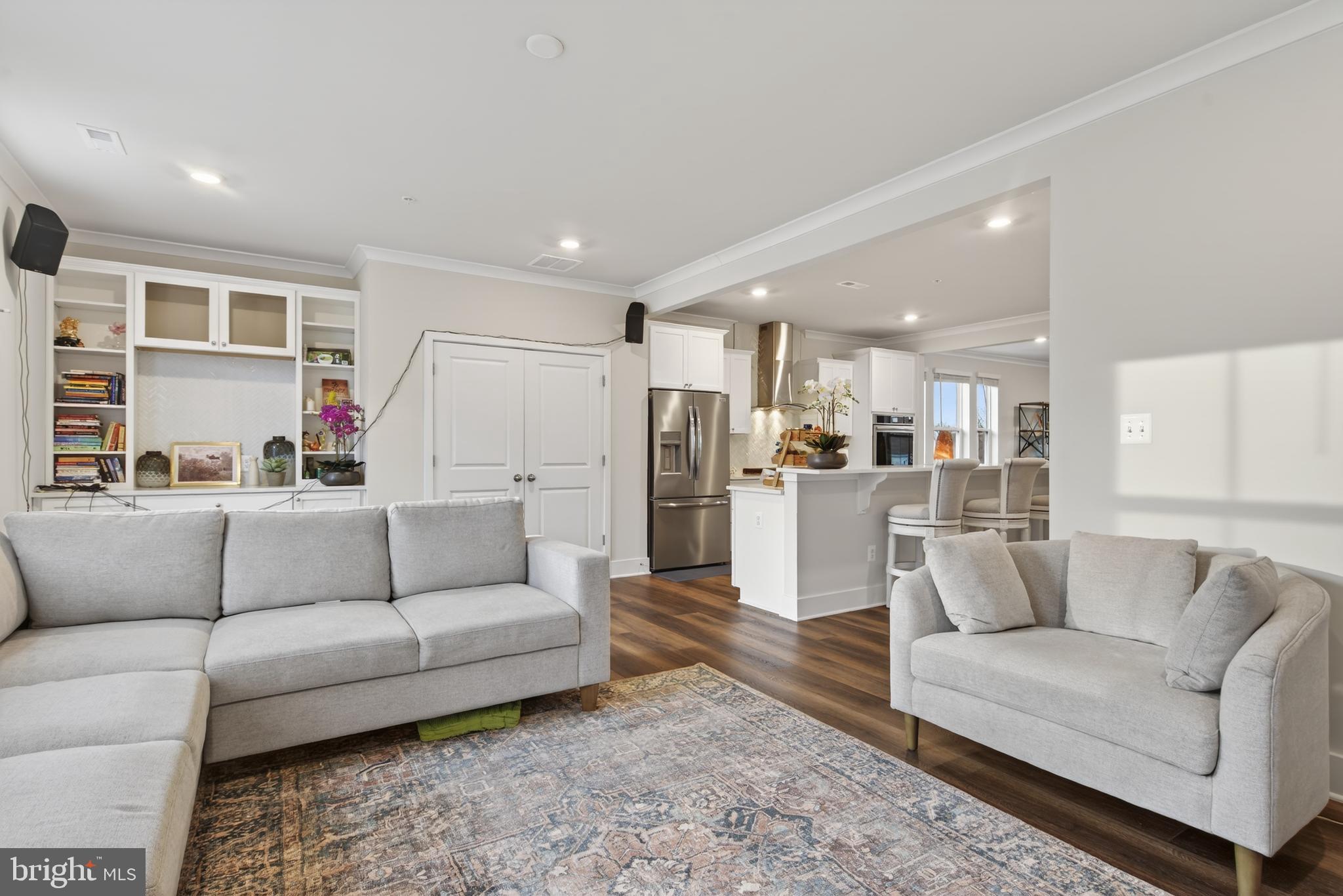 7201 Gringotts Way, Unit B Elkridge, MD 21075 - Photo 6 of 37 a living room with furniture and kitchen view