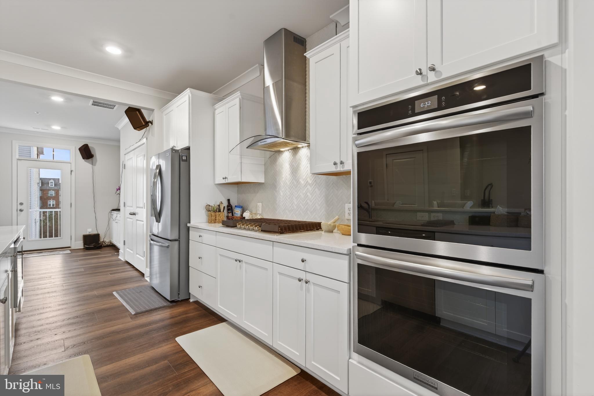 7201 Gringotts Way, Unit B Elkridge, MD 21075 - Photo 10 of 37 a kitchen with stainless steel appliances white cabinets and a stove