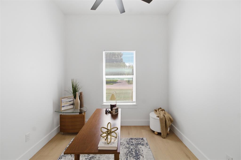 435 Waterboard Road Trinidad, TX 75163 - Photo 21 of 39 Light wood-finish flooring complements the crisp white walls