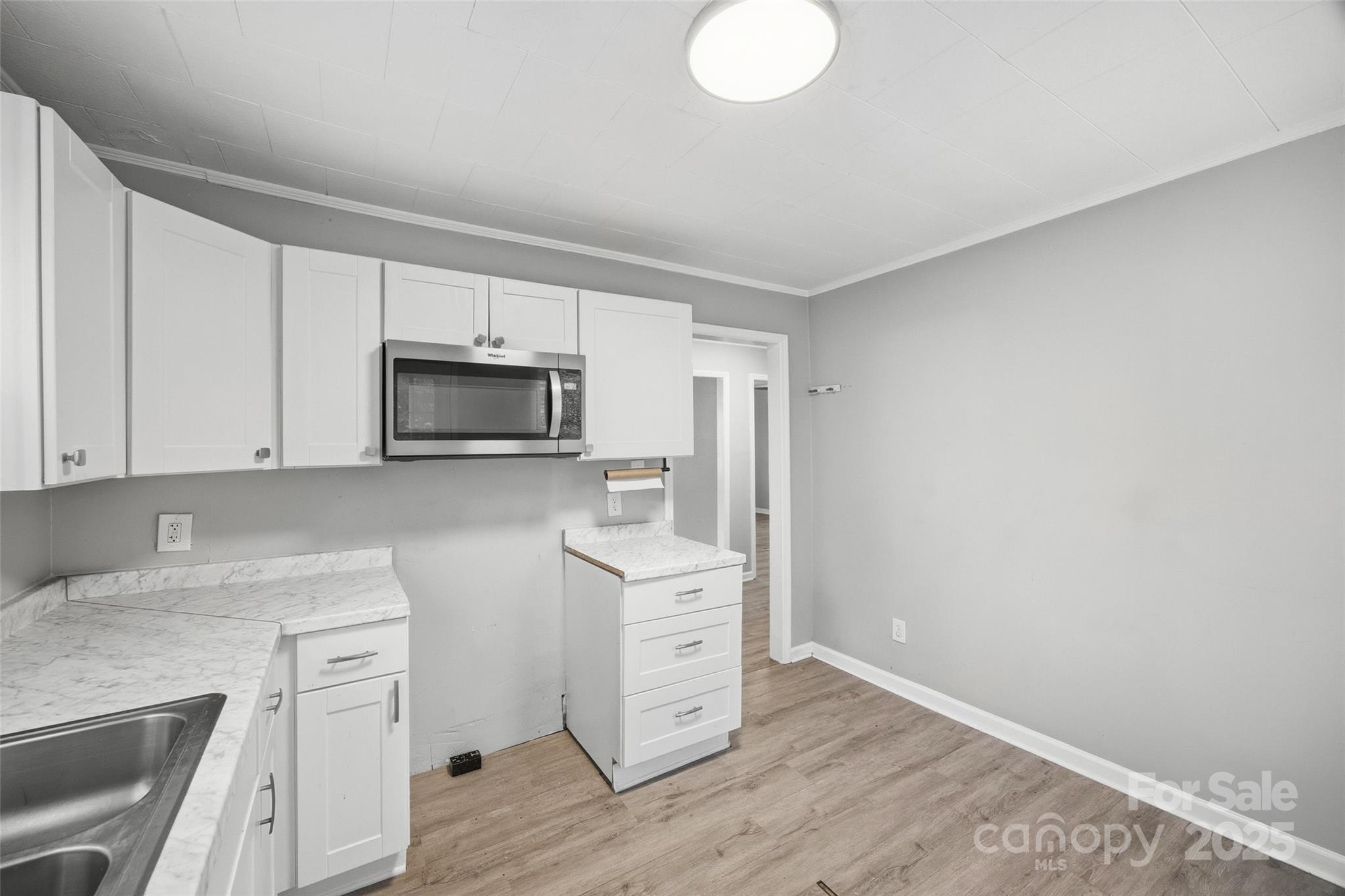 126 South Jackson Road Lancaster, SC 29720 - Photo 16 of 24 a kitchen with white cabinets stainless steel appliances and sink