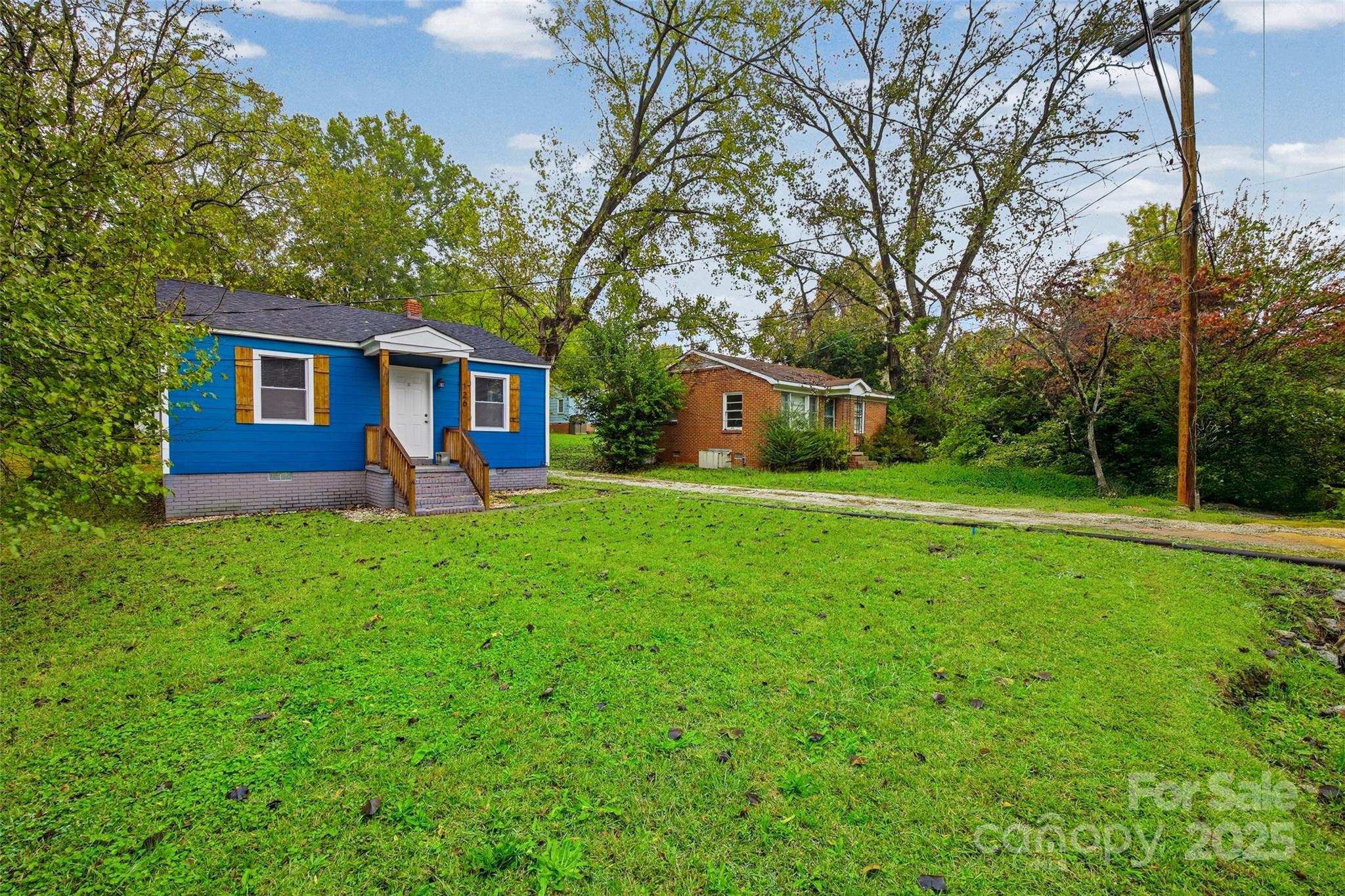 126 South Jackson Road Lancaster, SC 29720 - Photo 24 of 24 a view of a house with backyard and a tree