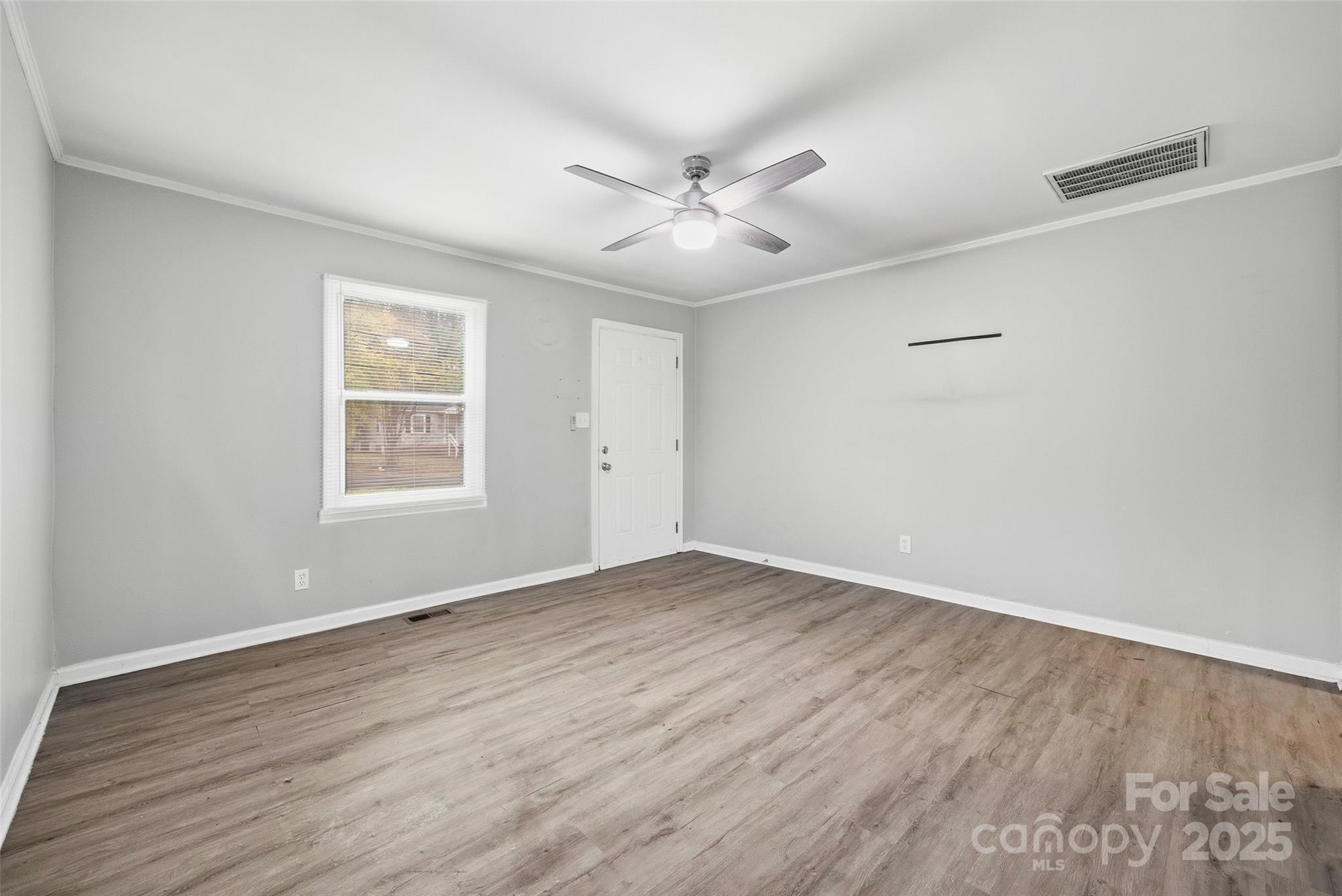 126 South Jackson Road Lancaster, SC 29720 - Photo 3 of 24 wooden floor in an empty room with a window