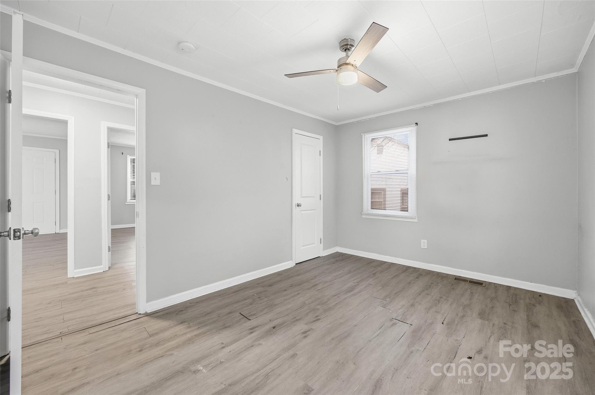 126 South Jackson Road Lancaster, SC 29720 - Photo 8 of 24 wooden floor in an empty room with a window