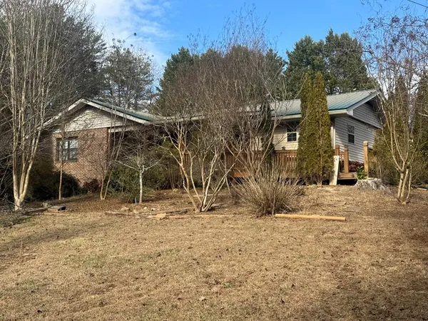 a view of a house with a snow on the road