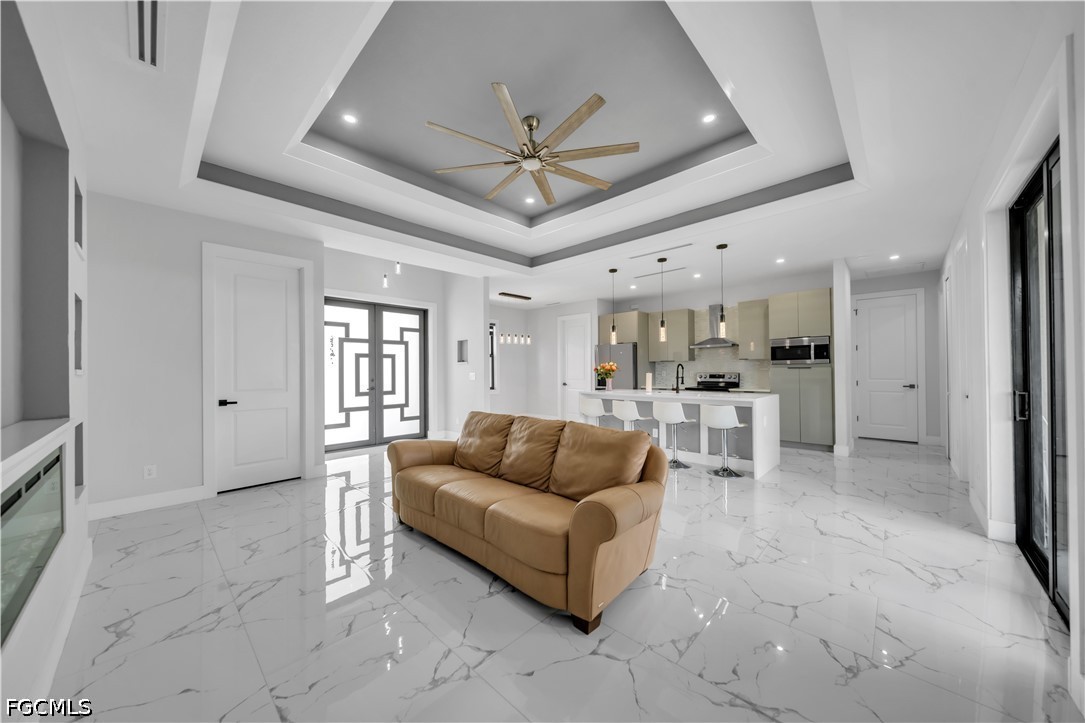1128 Nelson Road North Cape Coral, FL 33993 - Photo 8 of 22 a living room with furniture and view of kitchen