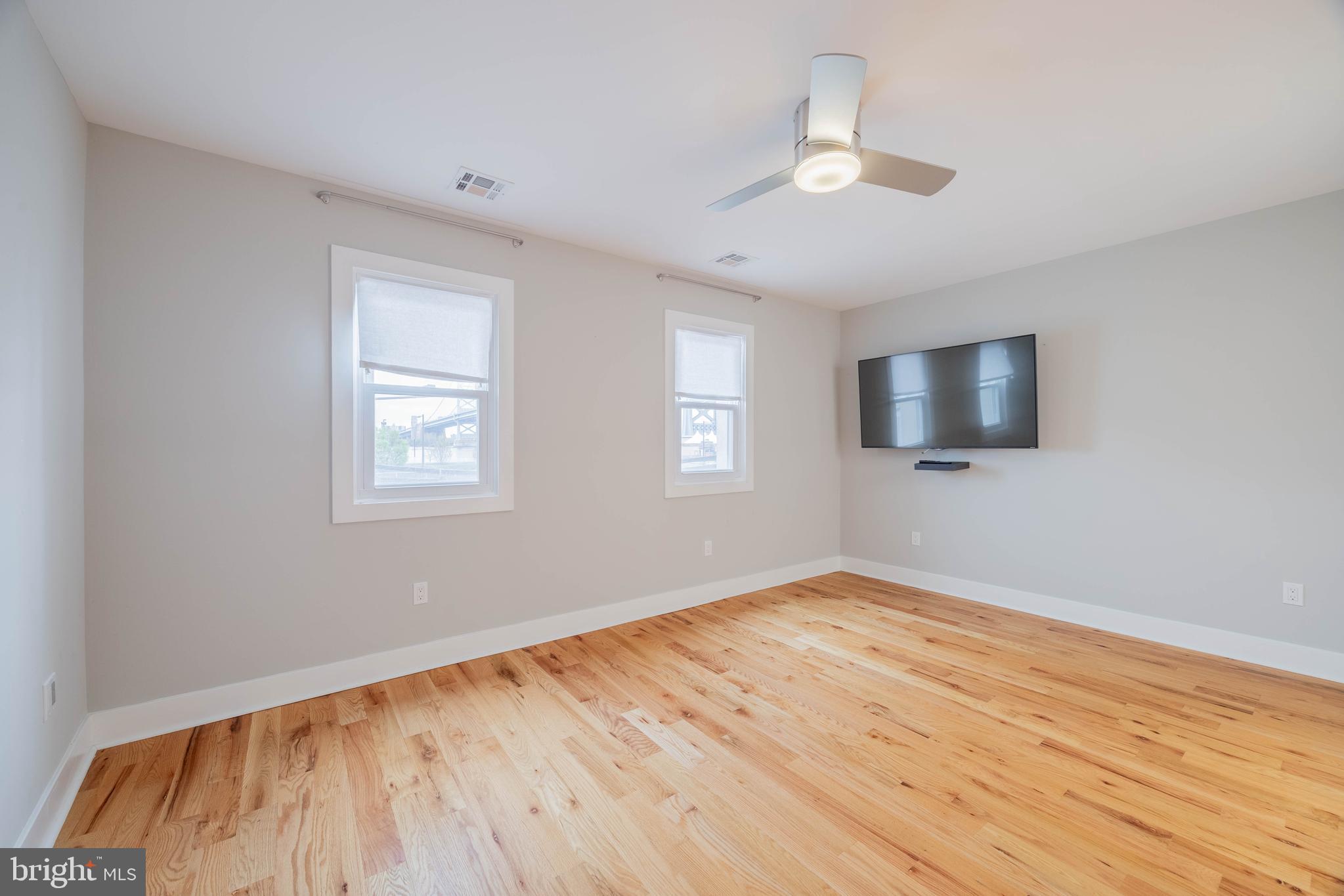 317 North Front Street Philadelphia, PA 19106 - Photo 12 of 27 a view of empty room with wooden floor and fan