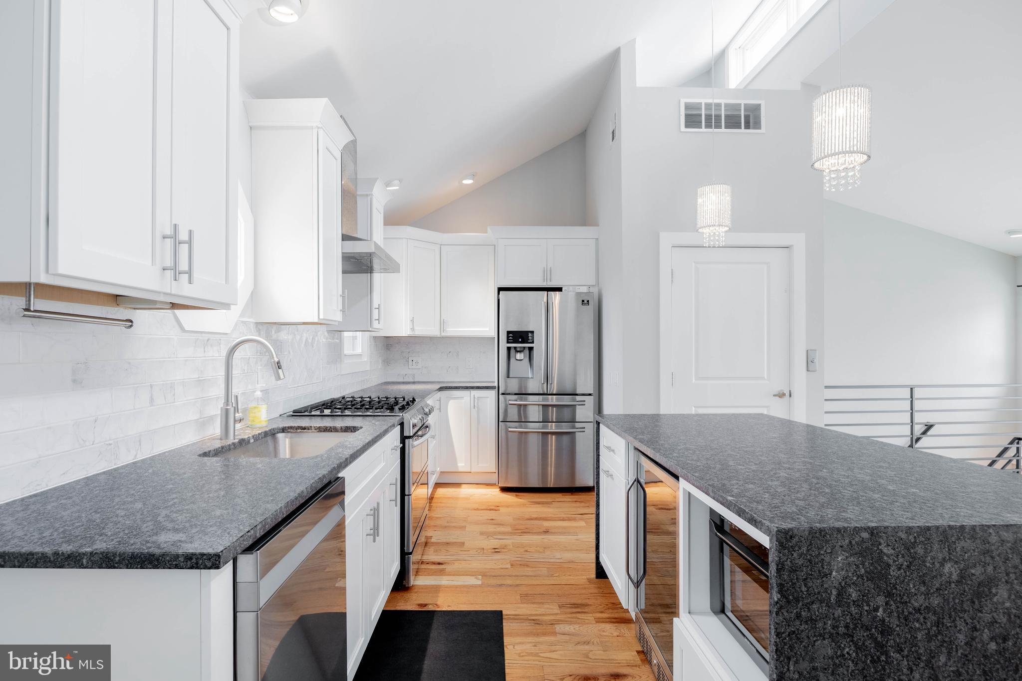317 North Front Street Philadelphia, PA 19106 - Photo 4 of 27 a kitchen with stainless steel appliances granite countertop a sink stove and refrigerator
