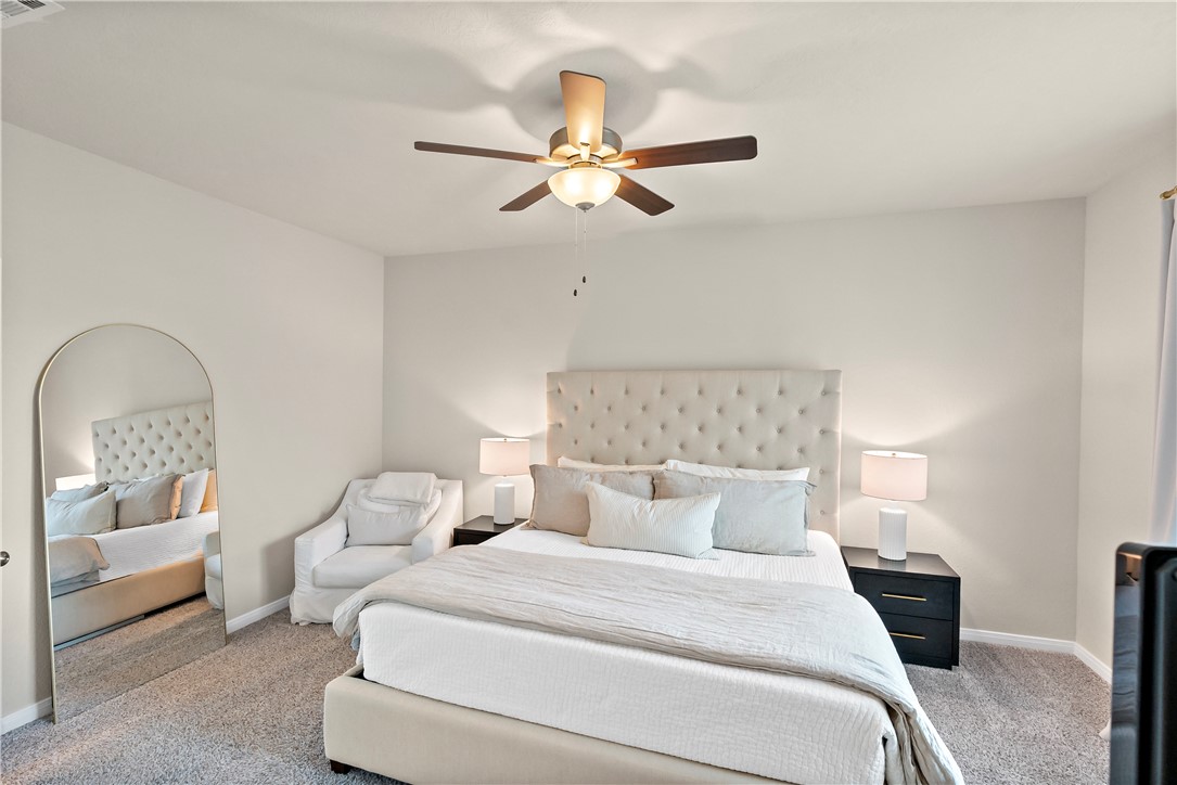 1310 Kingsgate Drive Bryan, TX 77807 - Photo 14 of 24 Carpeted bedroom with baseboards and a ceiling fan