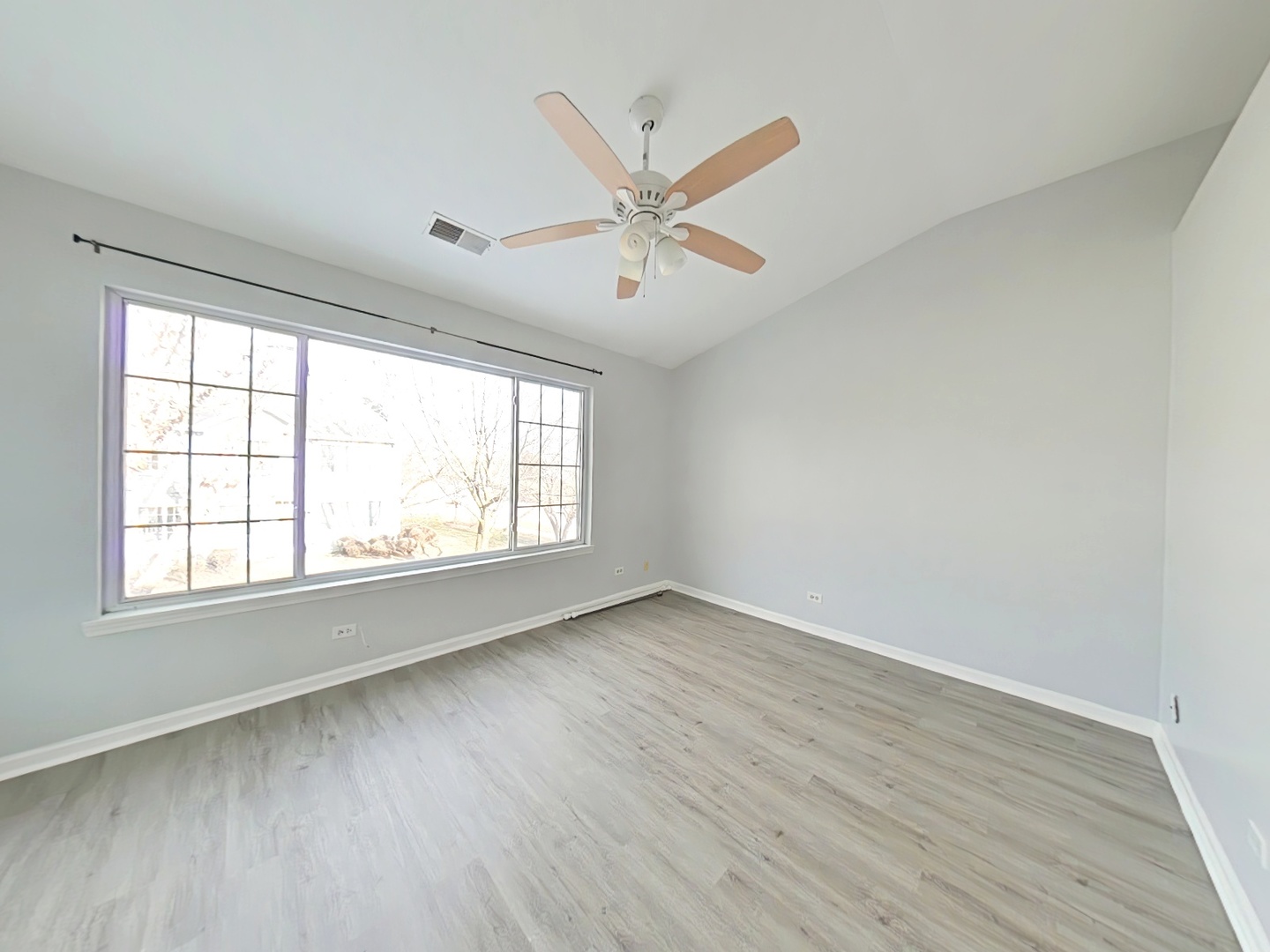 3003 Anton Drive Aurora, IL 60504 - Photo 4 of 10 wooden floor in an empty room with a window