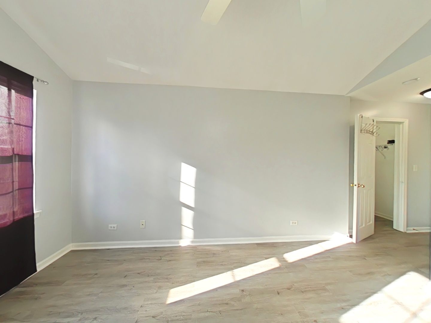 3003 Anton Drive Aurora, IL 60504 - Photo 6 of 10 a view of an empty room with wooden floor and a window