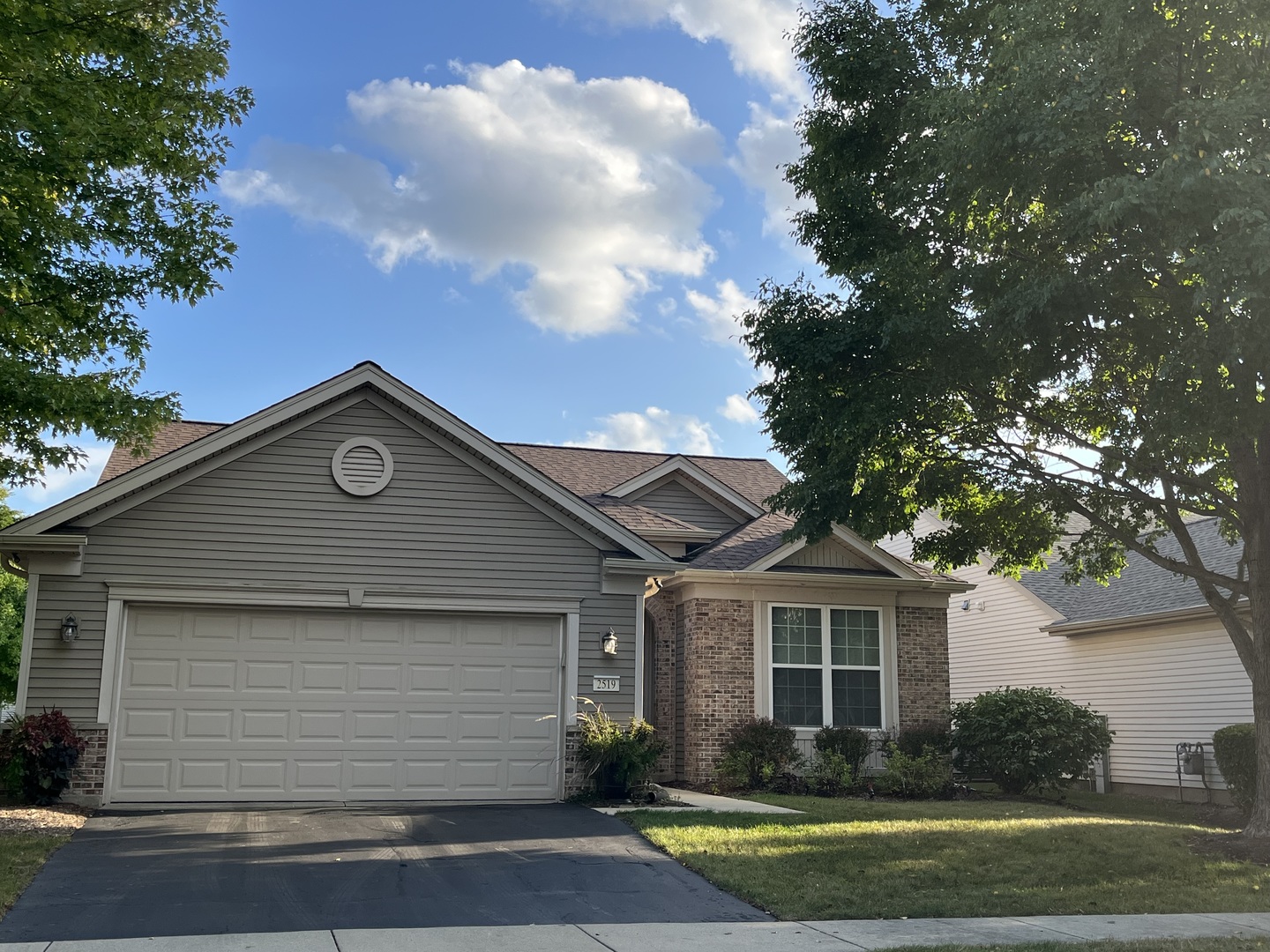 2519 Rolling Ridge Elgin, IL 60124 - Photo 1 of 1 a front view of a house with a garden
