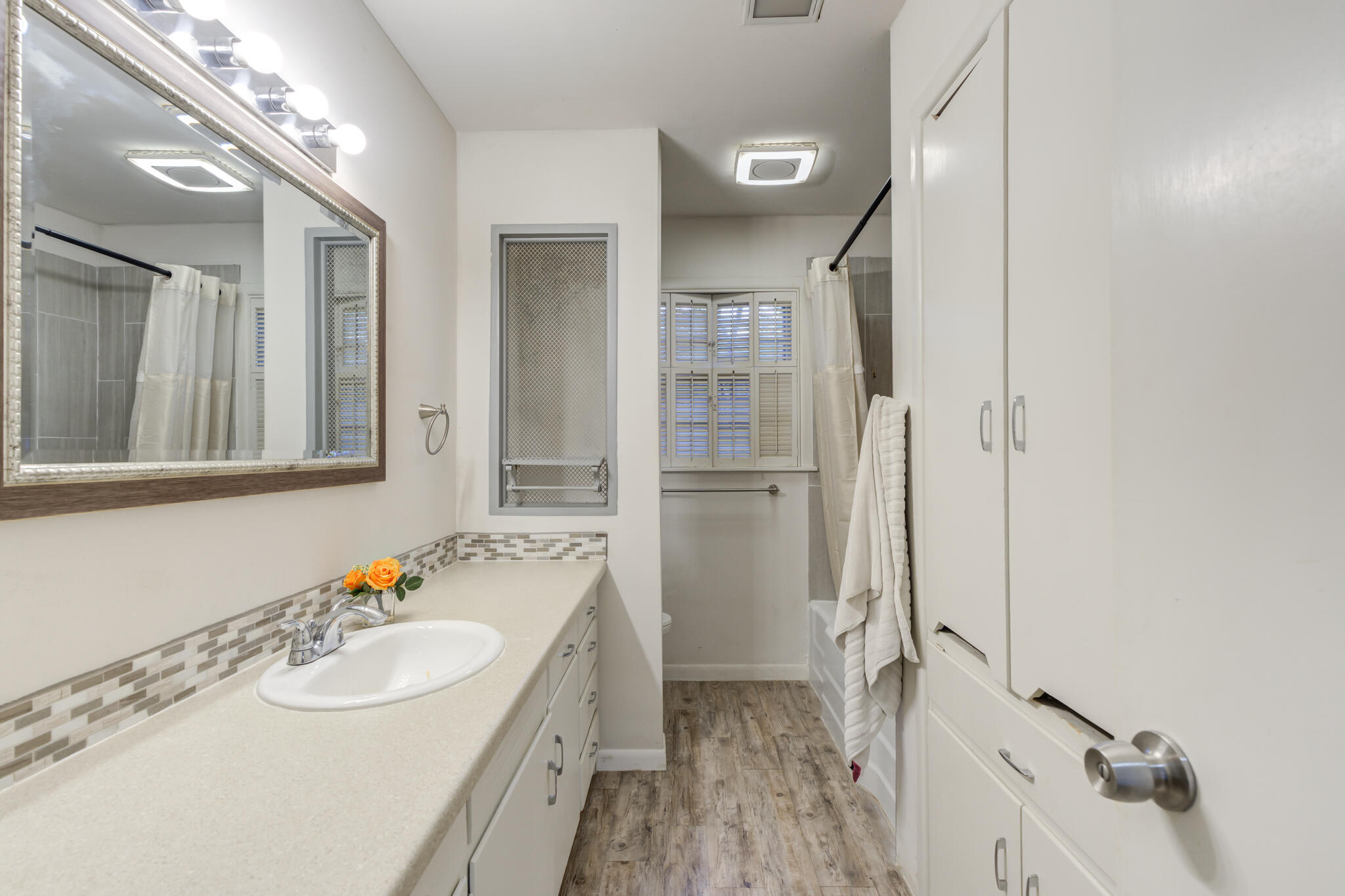 3614 45th Street Lubbock, TX 79413 - Photo 12 of 38 a bathroom with a sink toilet and shower