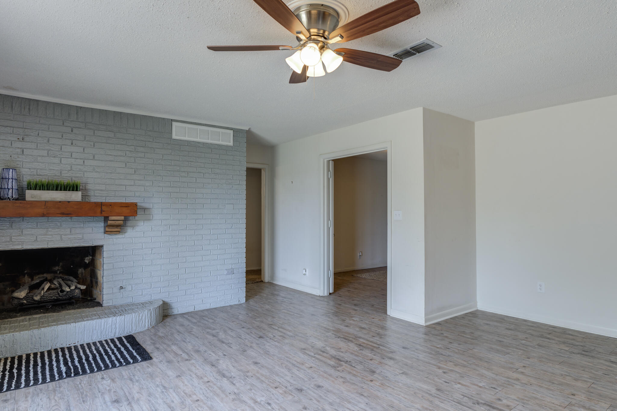 3614 45th Street Lubbock, TX 79413 - Photo 24 of 38 a view of an empty room with a fireplace