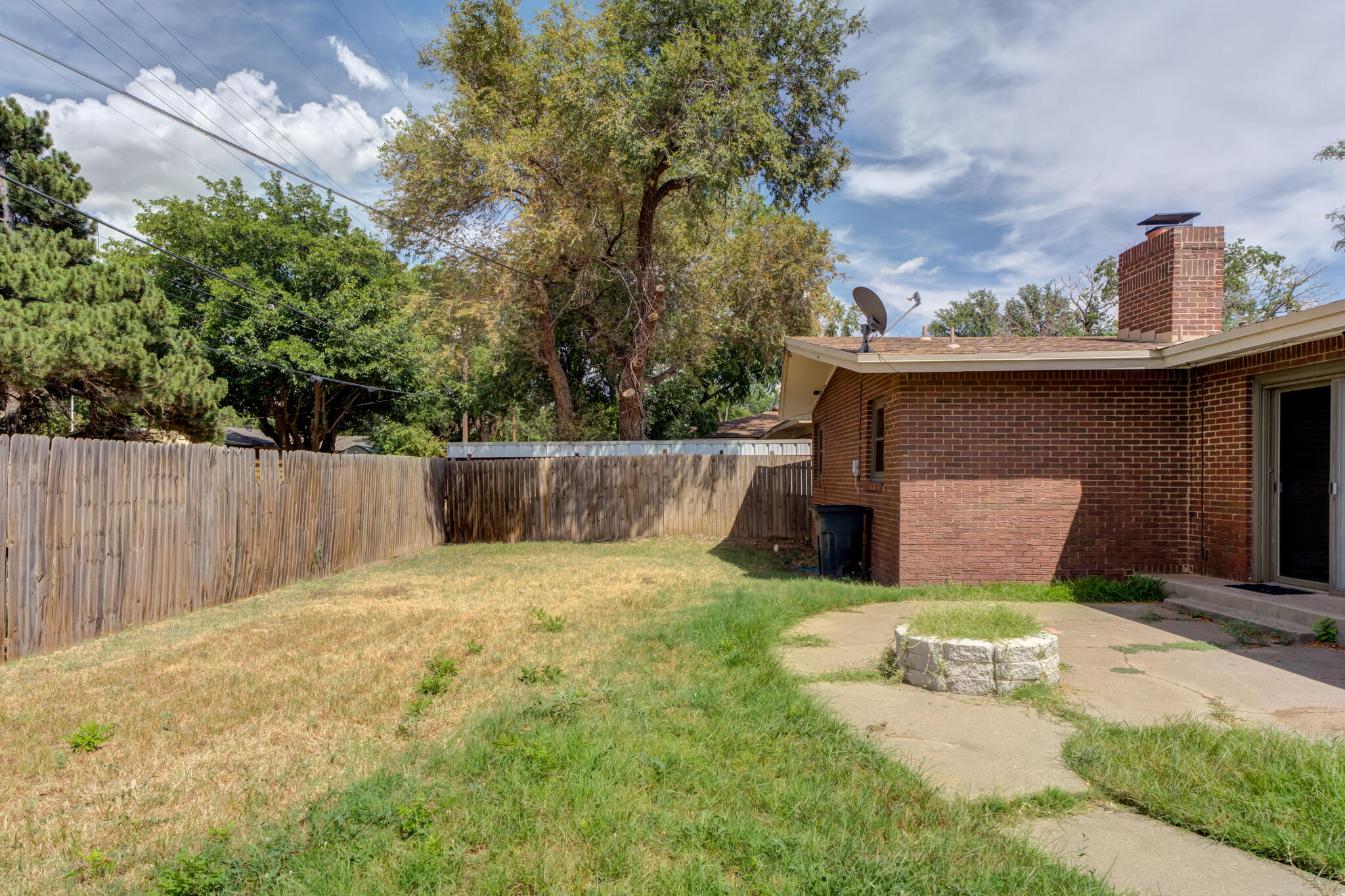 3614 45th Street Lubbock, TX 79413 - Photo 37 of 38 a view of a back yard of the house with an outdoor space