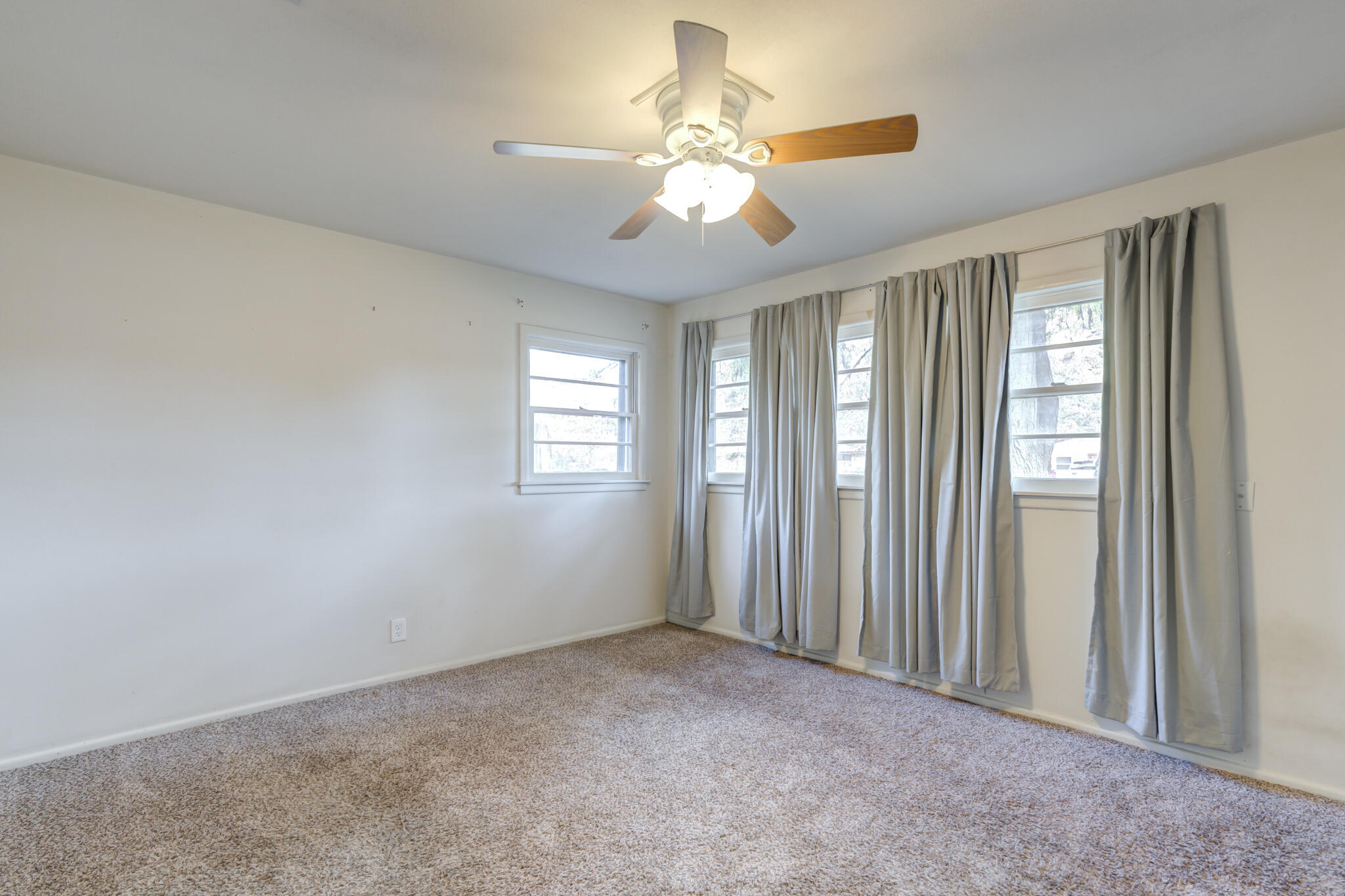 3614 45th Street Lubbock, TX 79413 - Photo 9 of 38 a view of an empty room with a window