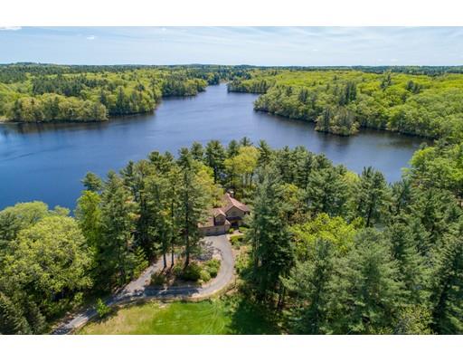 19 South Great Road Lincoln, MA 01773 - Photo 1 of 18 a view of a lake with houses in the back