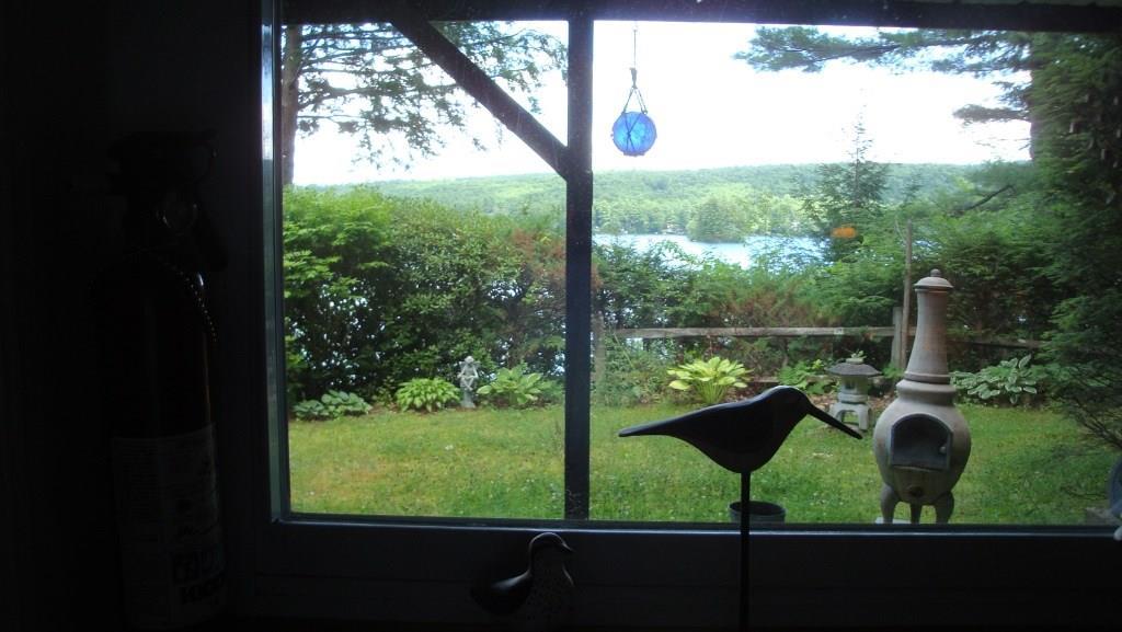 101 Swans Road Raymond, ME 04071 - Photo 25 of 35 Cottage #2 - View of garden and lake...