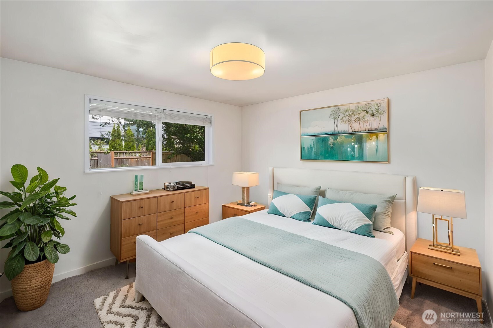 101 161st Street Southeast Bothell, WA 98012 - Photo 29 of 34 a bedroom with a bed and a potted plant